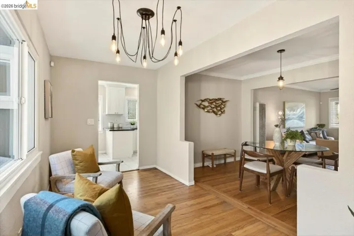 Dining space featuring light wood-type flooring and hanging lights