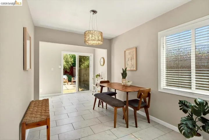 Dining space featuring baseboards and light tile patterned floors