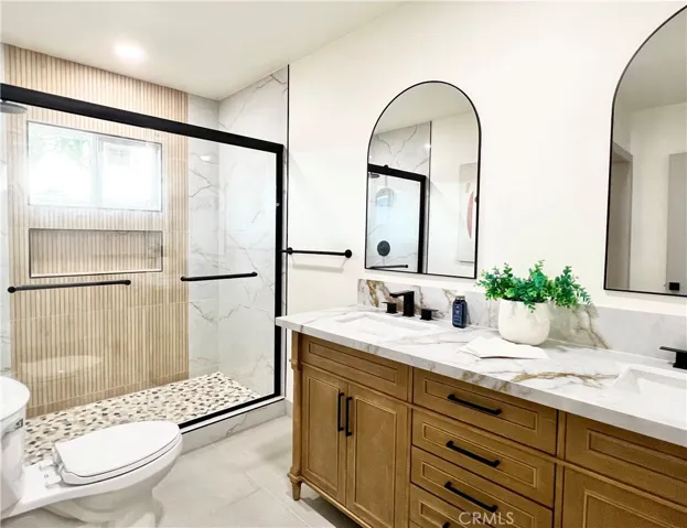 Oversized Primary Bathroom with Double Vanity and Spacious Shower