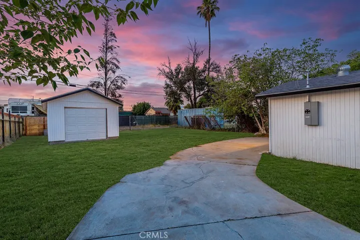 Photo has been digitally enhanced to show what the front yard would look like with grass. It is currently dirt.