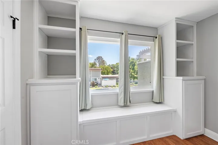 Bedroom 1 has custom built-in with storage bench