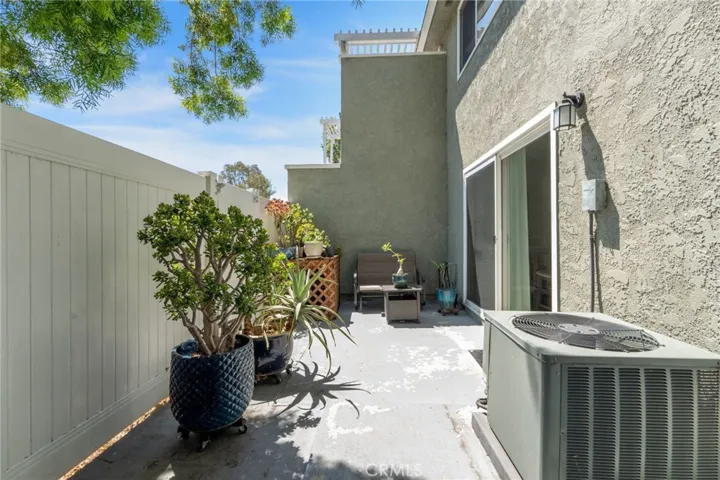 Larger patio with gate access and 6' fencing.
