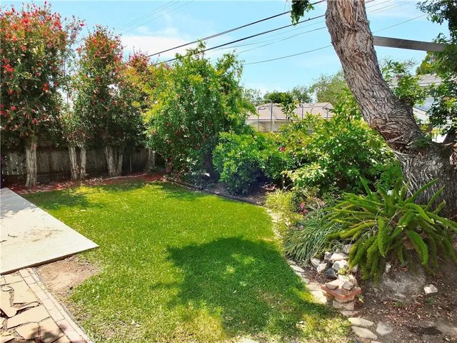 Spacious backyard with mature plantings