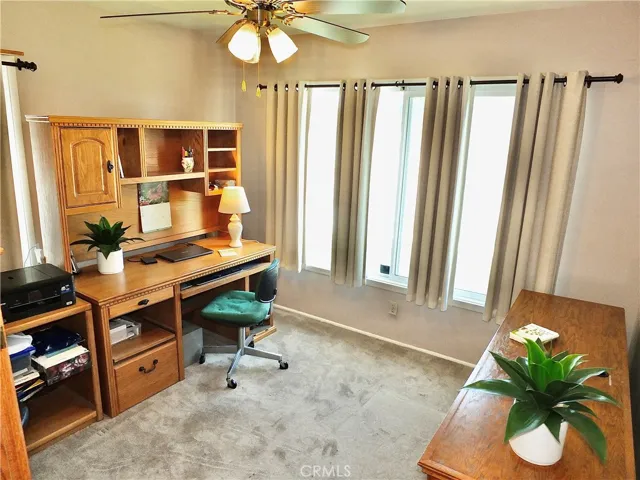 3rd bright bedroom is being used as an office