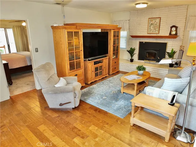 The large den even has a wood burning brick fireplace!