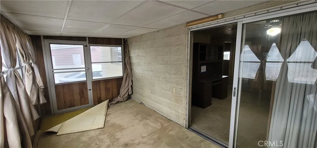 Enclosed porch with direct access to the backside parking space.