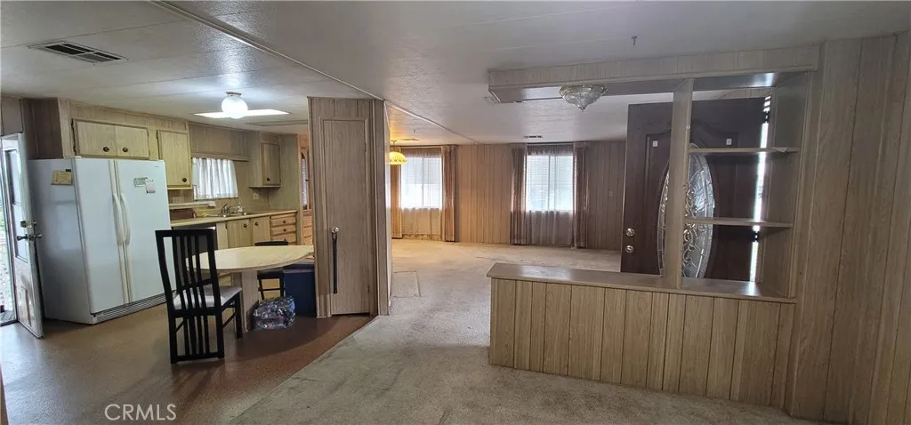 By removing the pony wall and the center kitchen wall, this space opens up and looks attractive. (see sold unit #391 for sample of improvement).