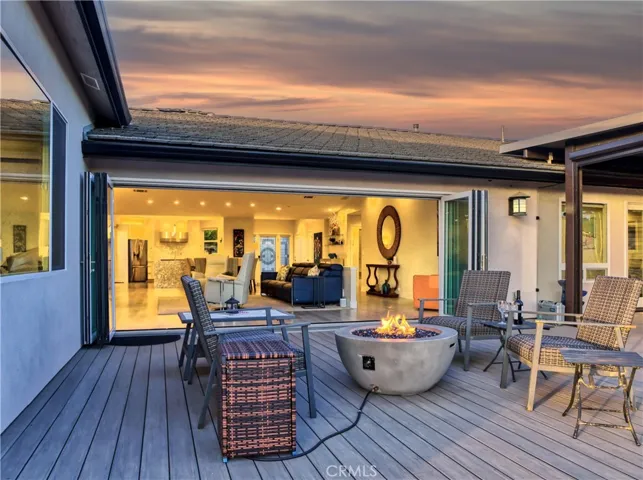 View from entertainment area into main living with retractable glass panel doors