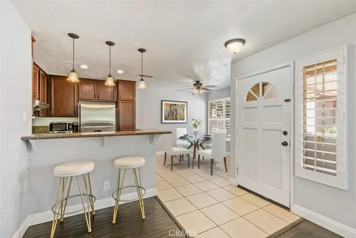 Beautiful remodeled kitchen with granite countertops, brand new refrigerator & cabinets have recently been freshly painted white.
*Photo is virtually staged.