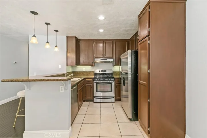 Kitchen cabinets have recently freshly painted white.  Condo comes with a brand new stainless steal refrigerator.

