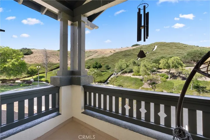Enjoy serene hill views from the front balcony
