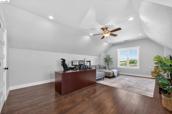 on suite #2 area featuring dark wood finished floors, ceiling fan, and recessed lighting, walk in closet and full bathroom