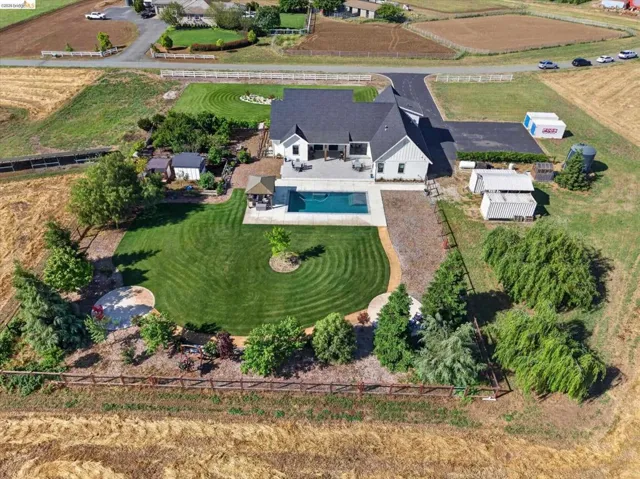 Aerial view of sparsely populated area with a pool area