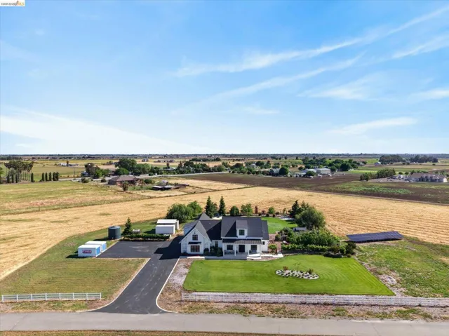 Aerial view of sparsely populated area with farmland