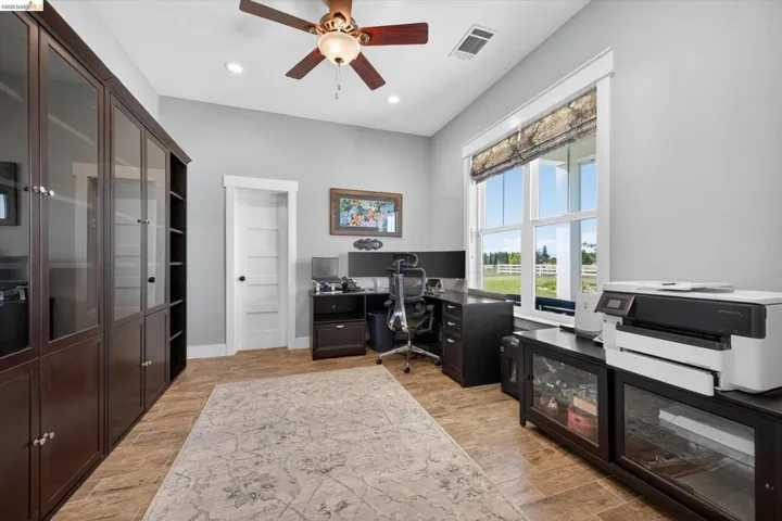 Office featuring a ceiling fan, recessed lighting, and light wood finished floors
