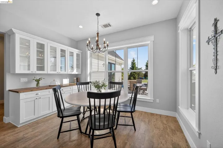 Dining space featuring a chandelier and light wood-style flooring