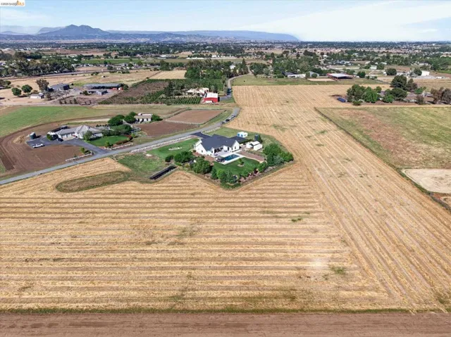 View of property location featuring rural landscape, extensive farmland, and mountains