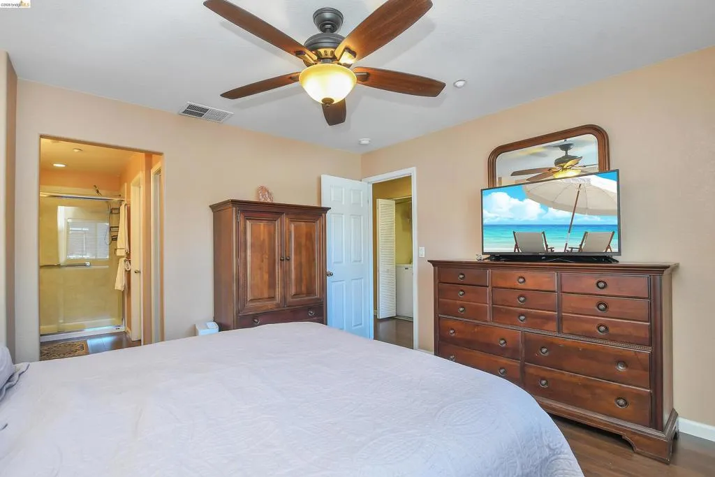 Bedroom featuring recessed lighting, a ceiling fan with light fixture, and wood-finish flooring