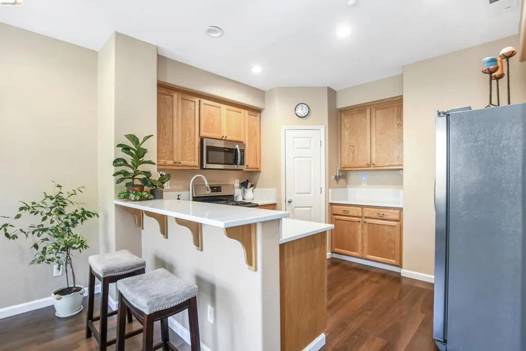 Kitchen featuring wood-finish flooring, recessed lighting, and light wood cabinetry