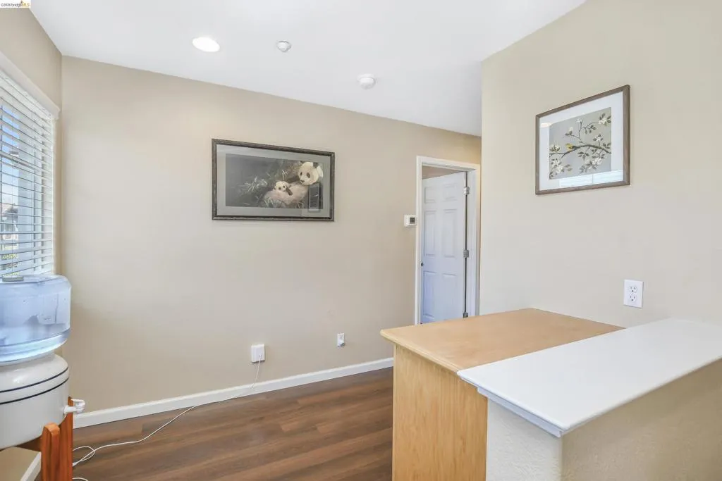 Interior space featuring wood-finish flooring, recessed lighting, and neutral wall paint