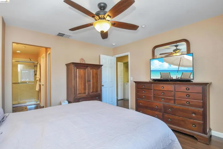 Bedroom featuring recessed lighting, a ceiling fan with light fixture, and wood-finish flooring