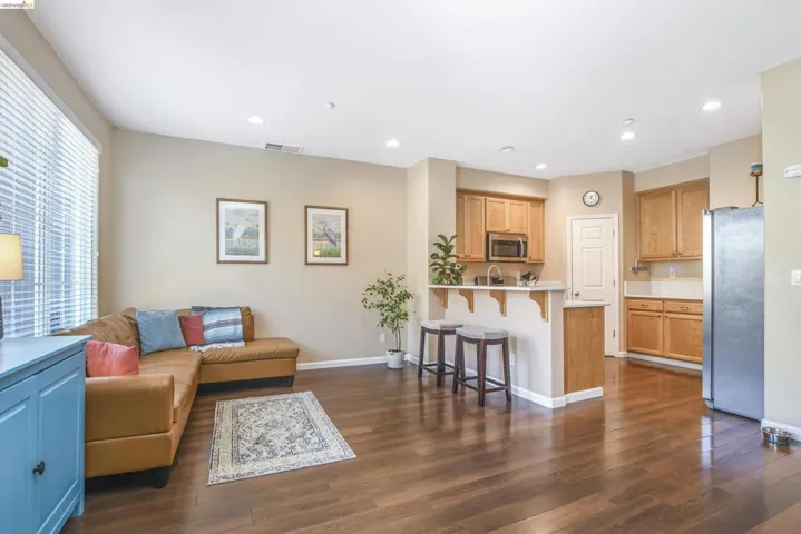 Open-concept living space featuring wood-finish flooring