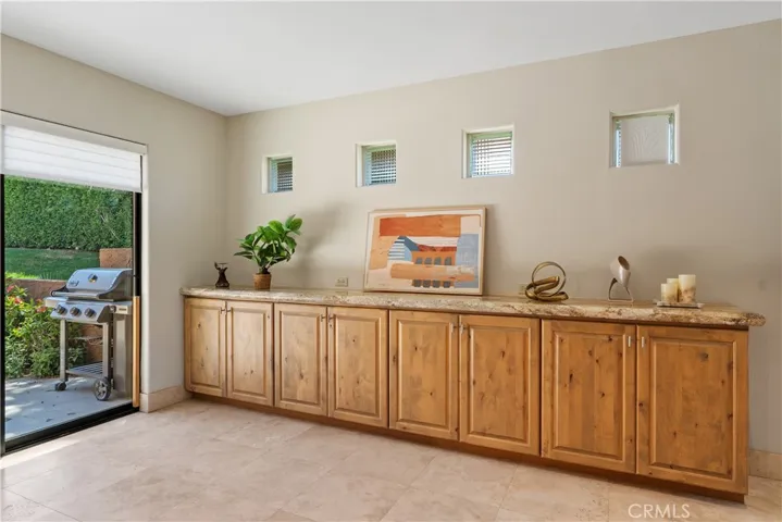 Beautiful built in cabinetry and easy access to outdoor patio.