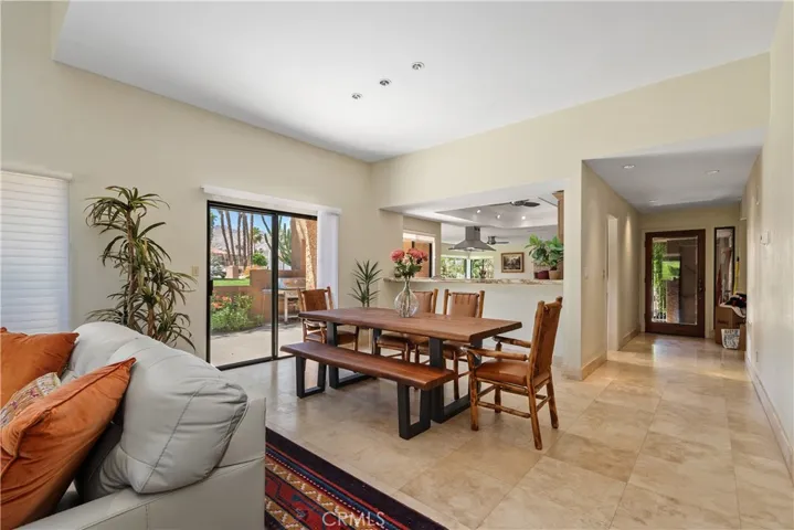 Dining area opens to the kitchen and side patio area.