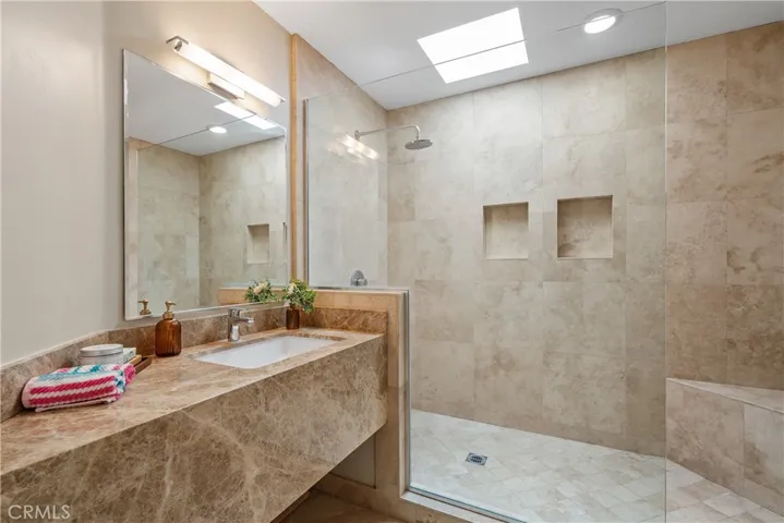 Large hallway bathroom with luxurious walk in shower.