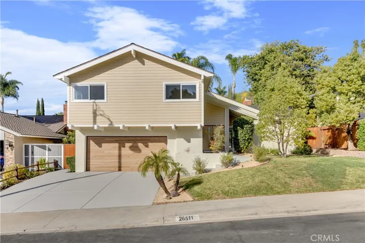 Front view of the property showcasing the modern design, well-maintained exterior, and landscaped yard.