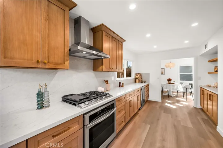 A well-lit kitchen with ample storage, featuring sleek countertops, modern appliances, and a spacious layout ideal for cooking and entertaining.