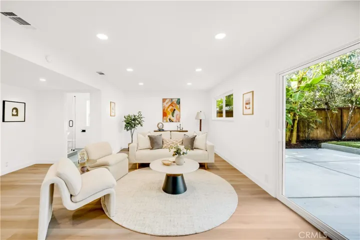 Bright and spacious family room with seamless access to the backyard, perfect for entertaining or relaxation.