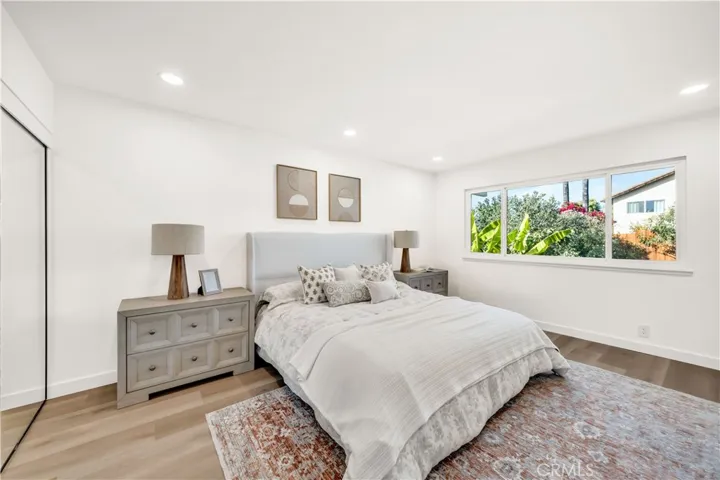 Bright master bedroom showcasing large windows with a view of the greenery outside, creating a serene and tranquil​​‌​​​​‌​​‌‌​​‌​​​‌‌​​​‌​​‌‌​​‌‌​​‌‌​​​​ atmosphere.