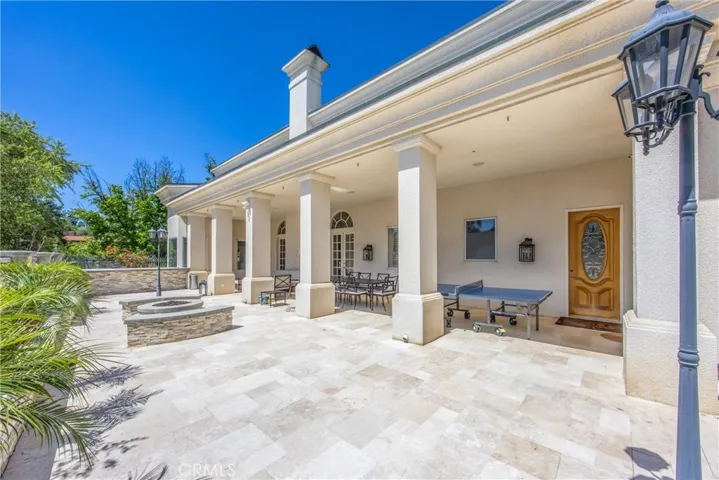 Timeless architecture frames this inviting outdoor living space.