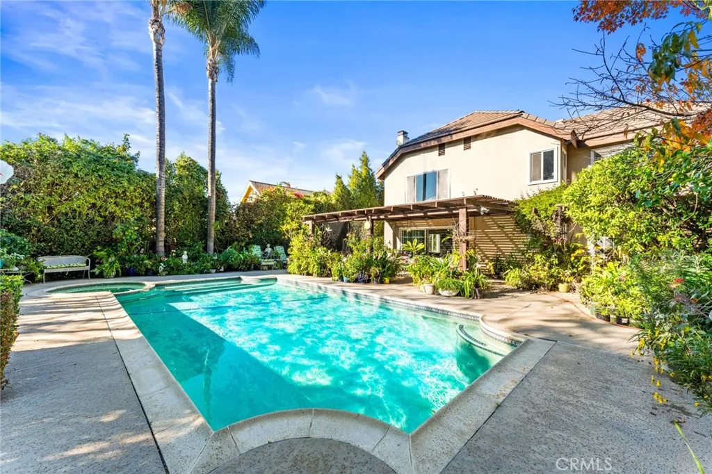Sparkling pool the other side of the patio - so much space & privacy in this back yard oasis
