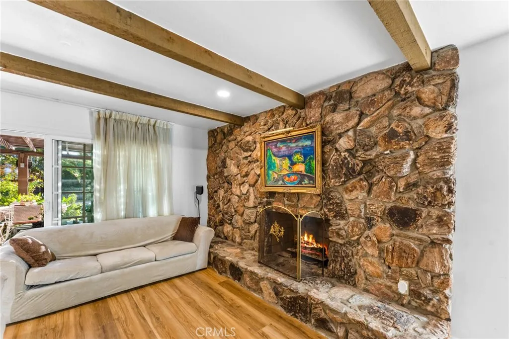Floor to ceiling natural rock fireplace is like a beautiful piece of artwork!