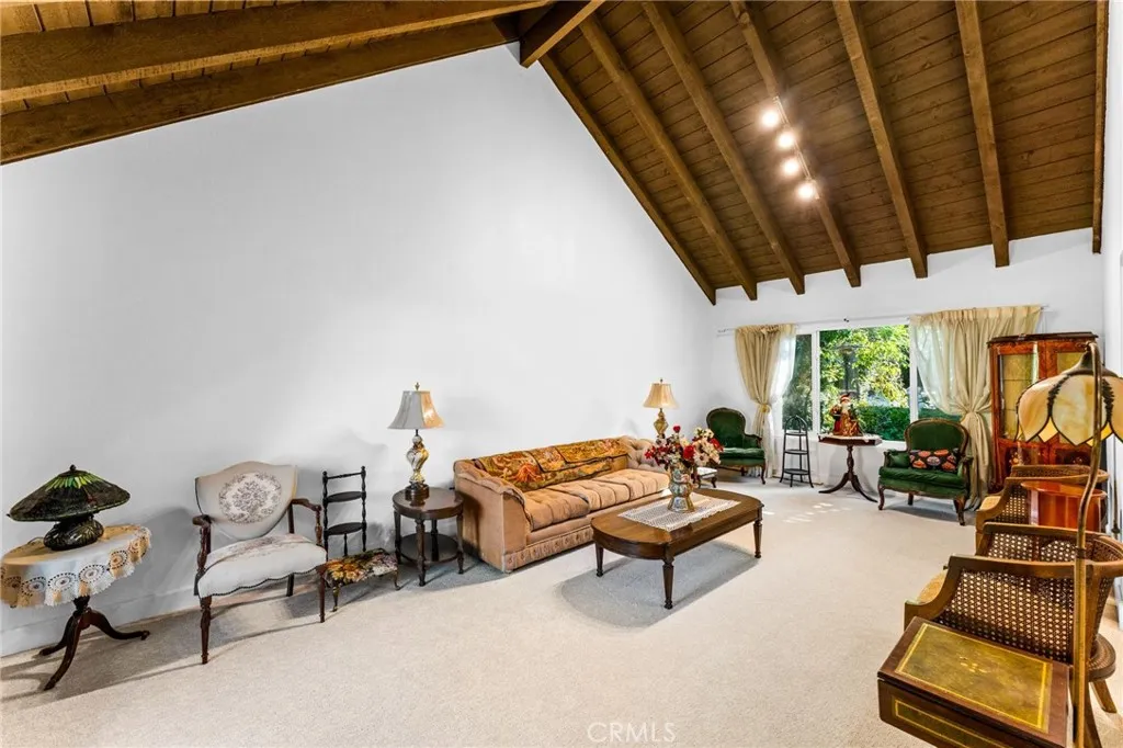 Cathedral ceilings with beautifully accented wood-beamed ceiling