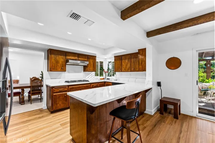 Family room looking into kitchen. Love the laminate wood flooring