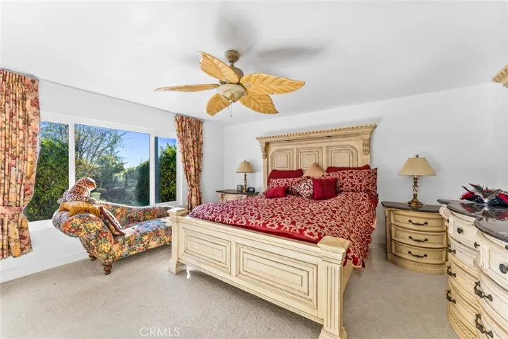 Primary bedroom overlooks back yard oasis.  So private and extra-large