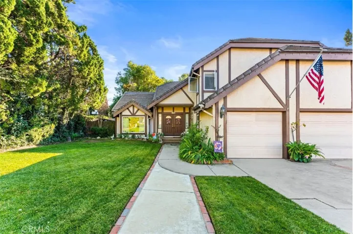 Home is set back from the street for extra privacy. Love the extra-long driveway & 3 car garage