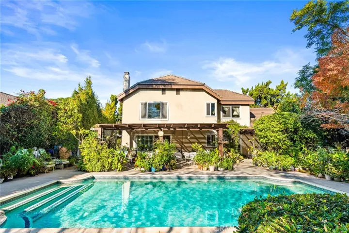 Pool is so large with plenty of room for the back yard patio & a lush oasis on the other side of the pool. Lot is truly amazing