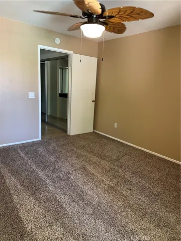 Primary bedroom with ceiling fan