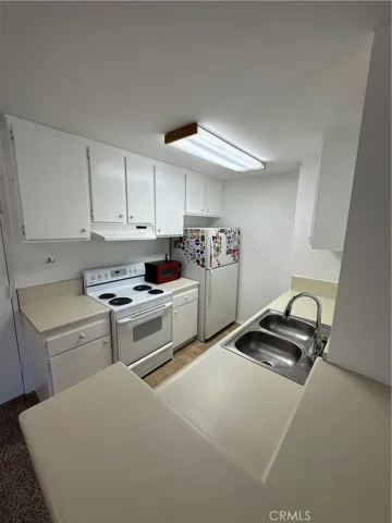 Bright functional kitchen with microwave included
