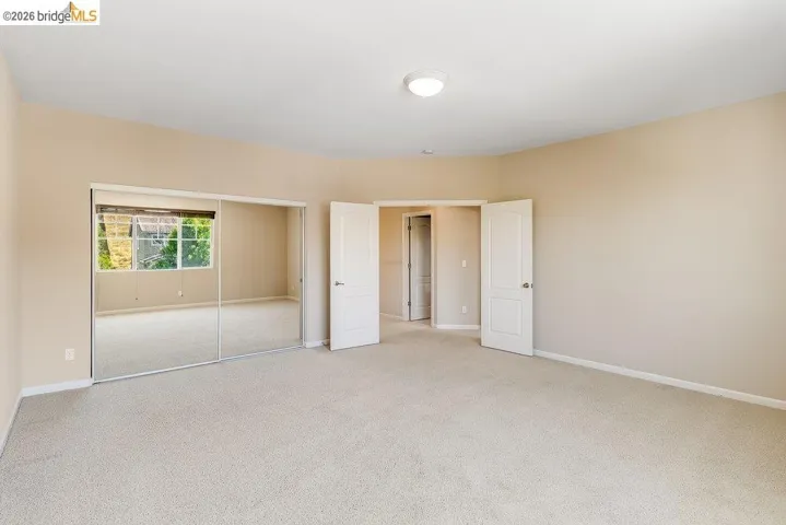 Unfurnished bedroom with a closet and carpet flooring