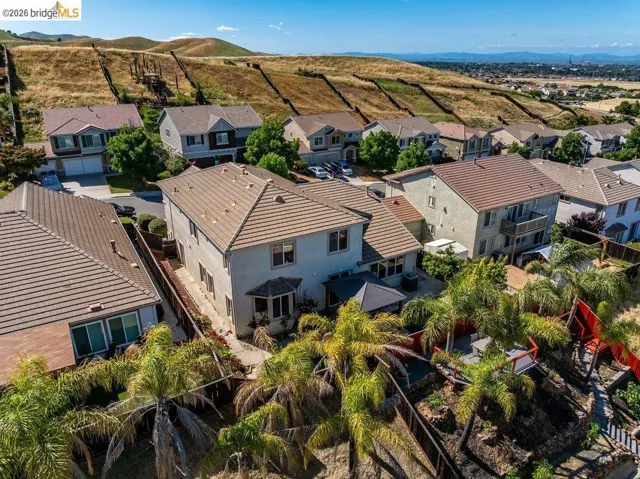 Aerial view of residential area featuring a mountain backdrop