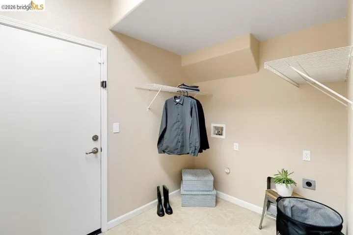 Walk in closet featuring light floors