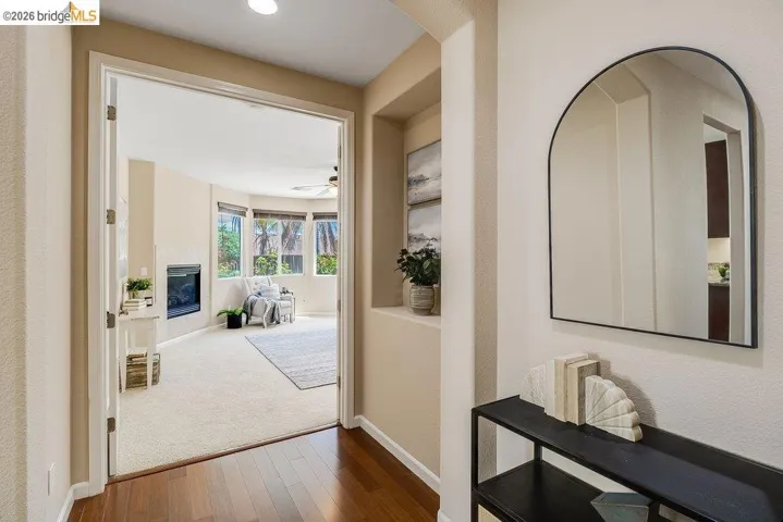 Hall featuring baseboards and hardwood / wood-style floors