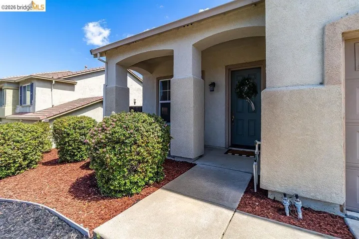 Property entrance featuring stucco siding