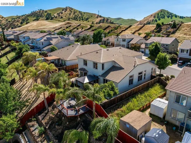 Aerial view of residential area featuring a mountain backdrop
