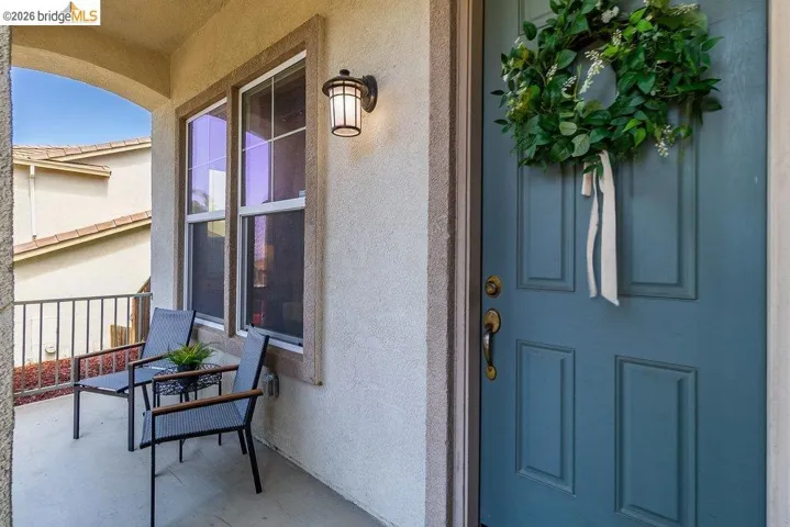 Property entrance featuring stucco siding